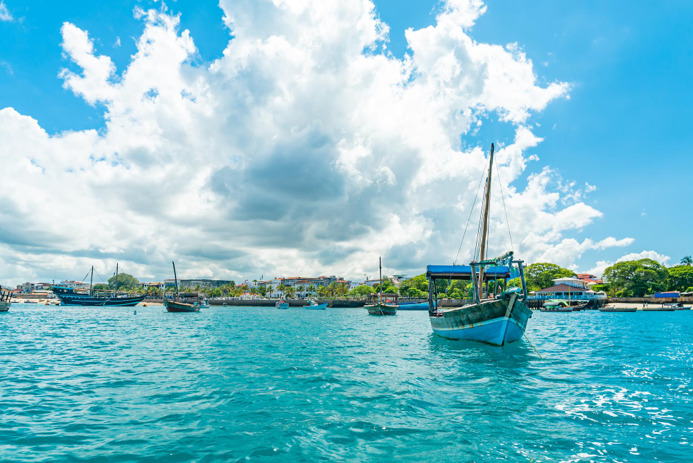 Wooden dhow boats moored at the waterfront in Stone Town, Zanzibar