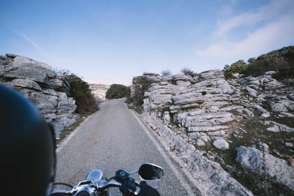 Motorcyclist on a winding mountain road