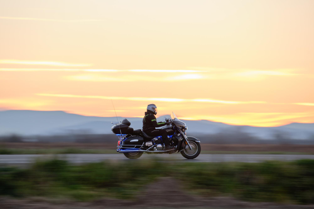 A rider on a coastal road near Paphos at dusk