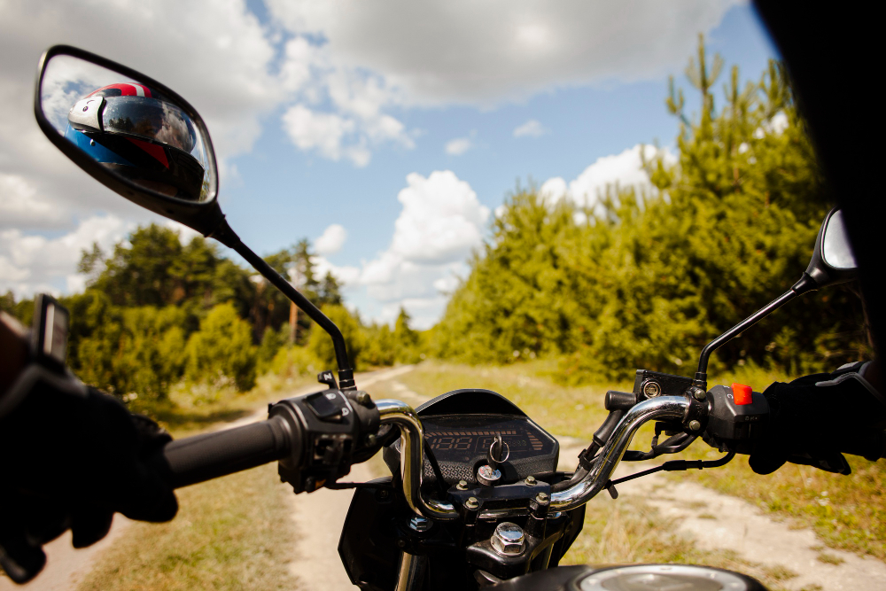 Rider on a motorbike on a mountain dirt road