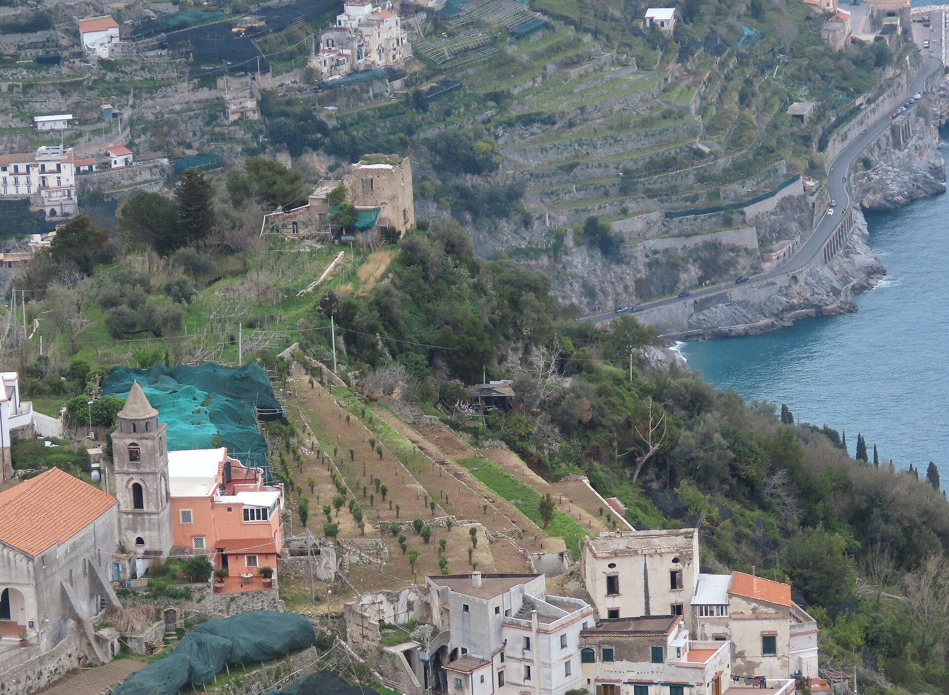 The narrow coastal road winding along the cliffs of the Amalfi Coast