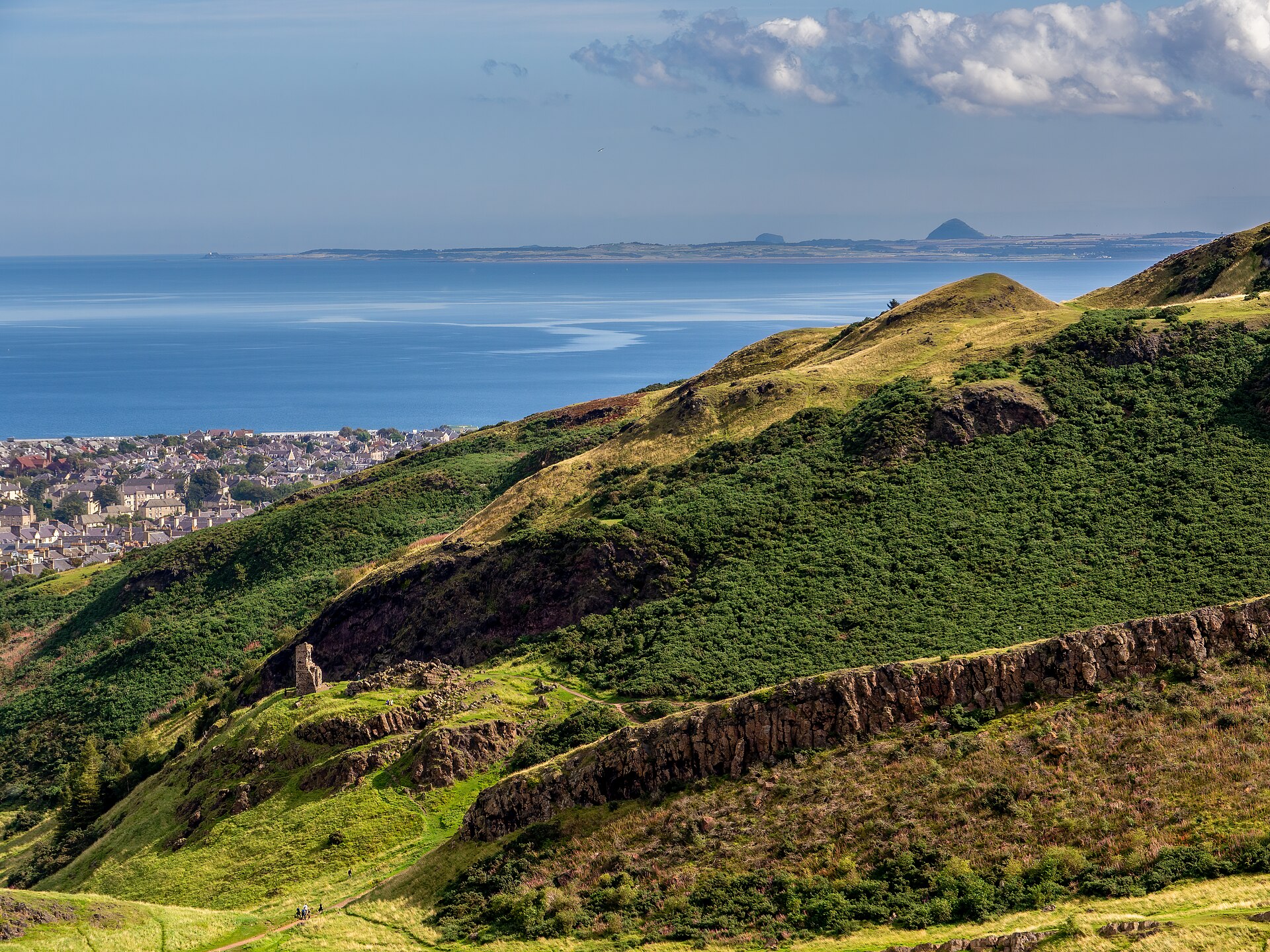 The grassy summit ridge of Arthur's Seat above Holyrood Park in Edinburgh