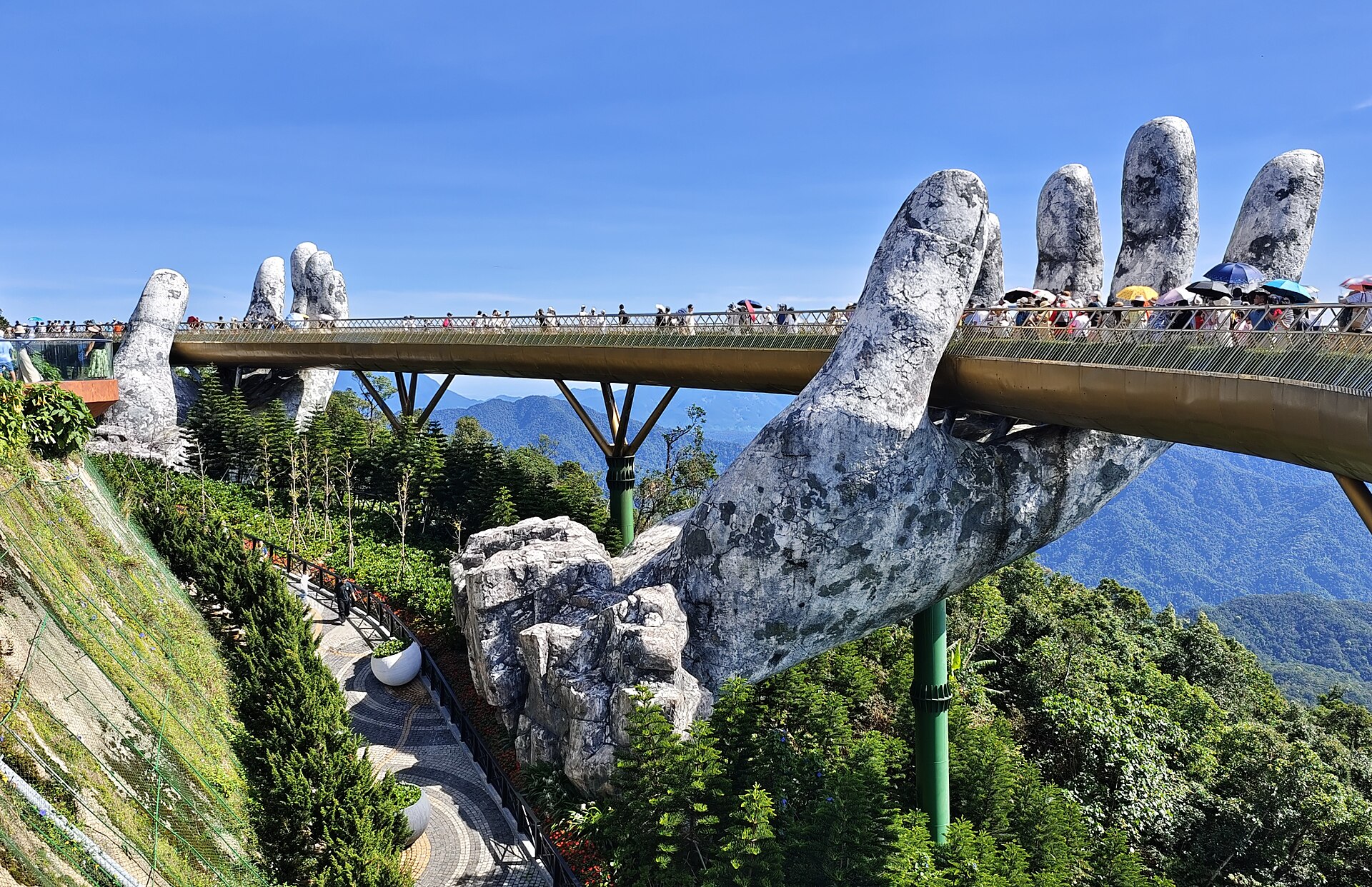 The Golden Bridge held up by giant stone hands at Ba Na Hills near Da Nang