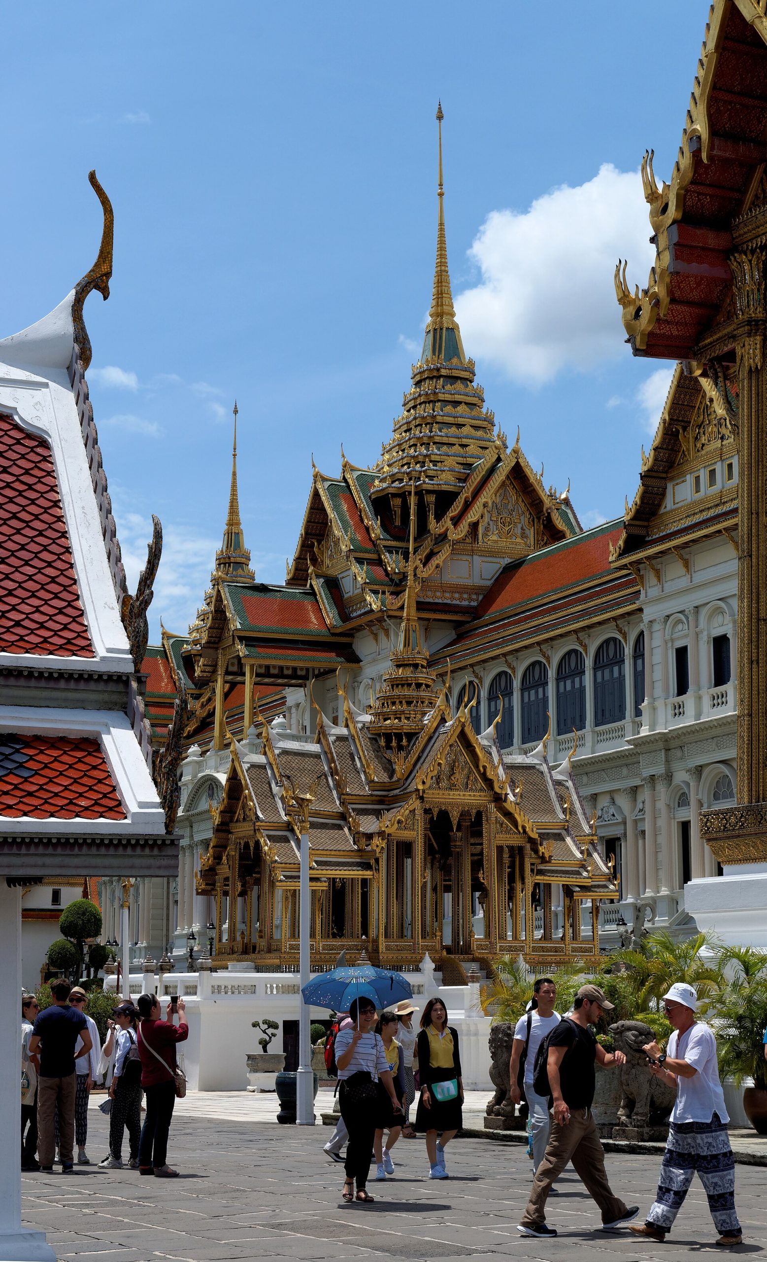 Gilded spires and mosaic-covered walls at the Grand Palace complex in Bangkok