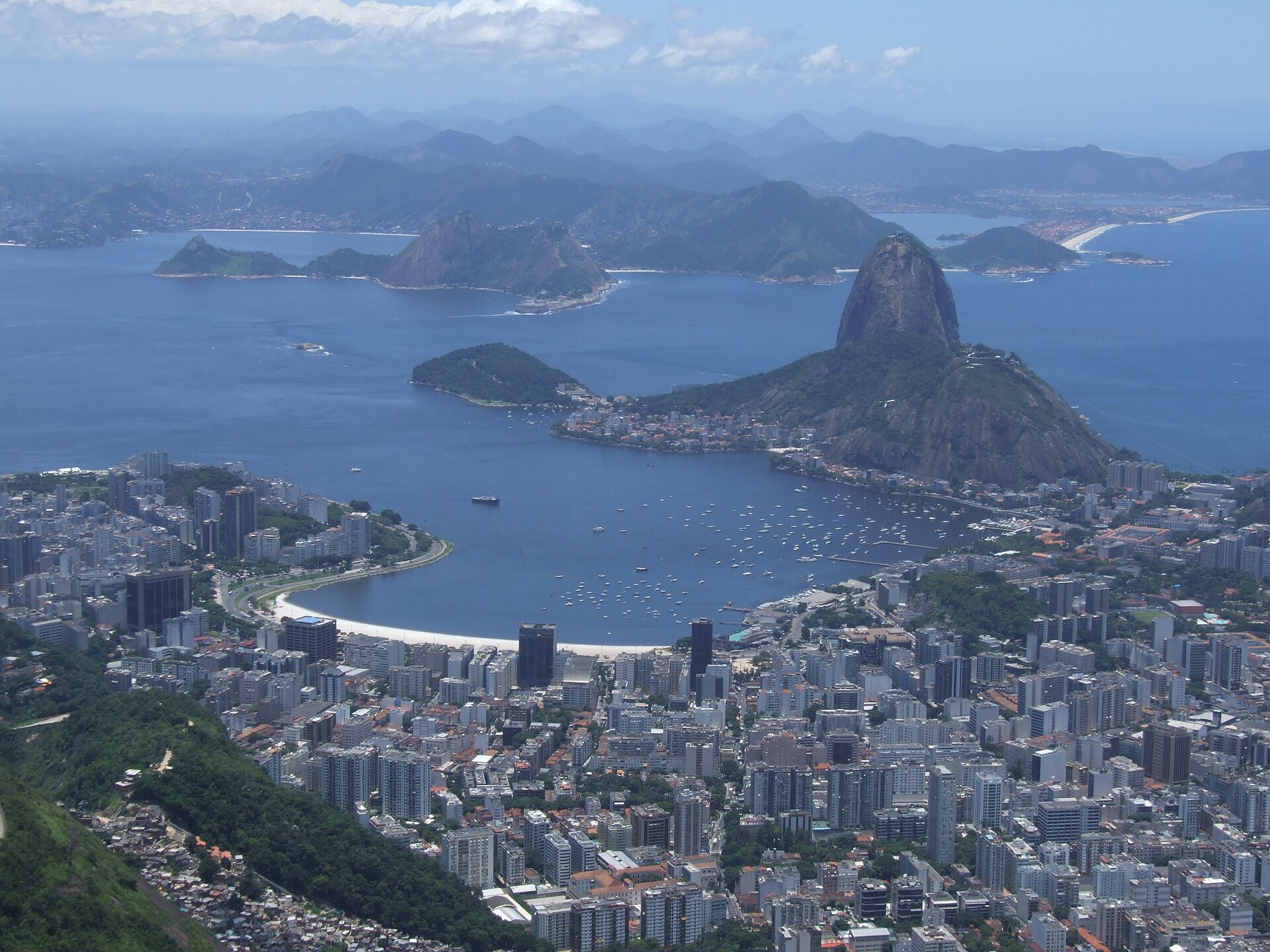 Botafogo bay with moored boats and Sugarloaf Mountain behind it in Rio de Janeiro