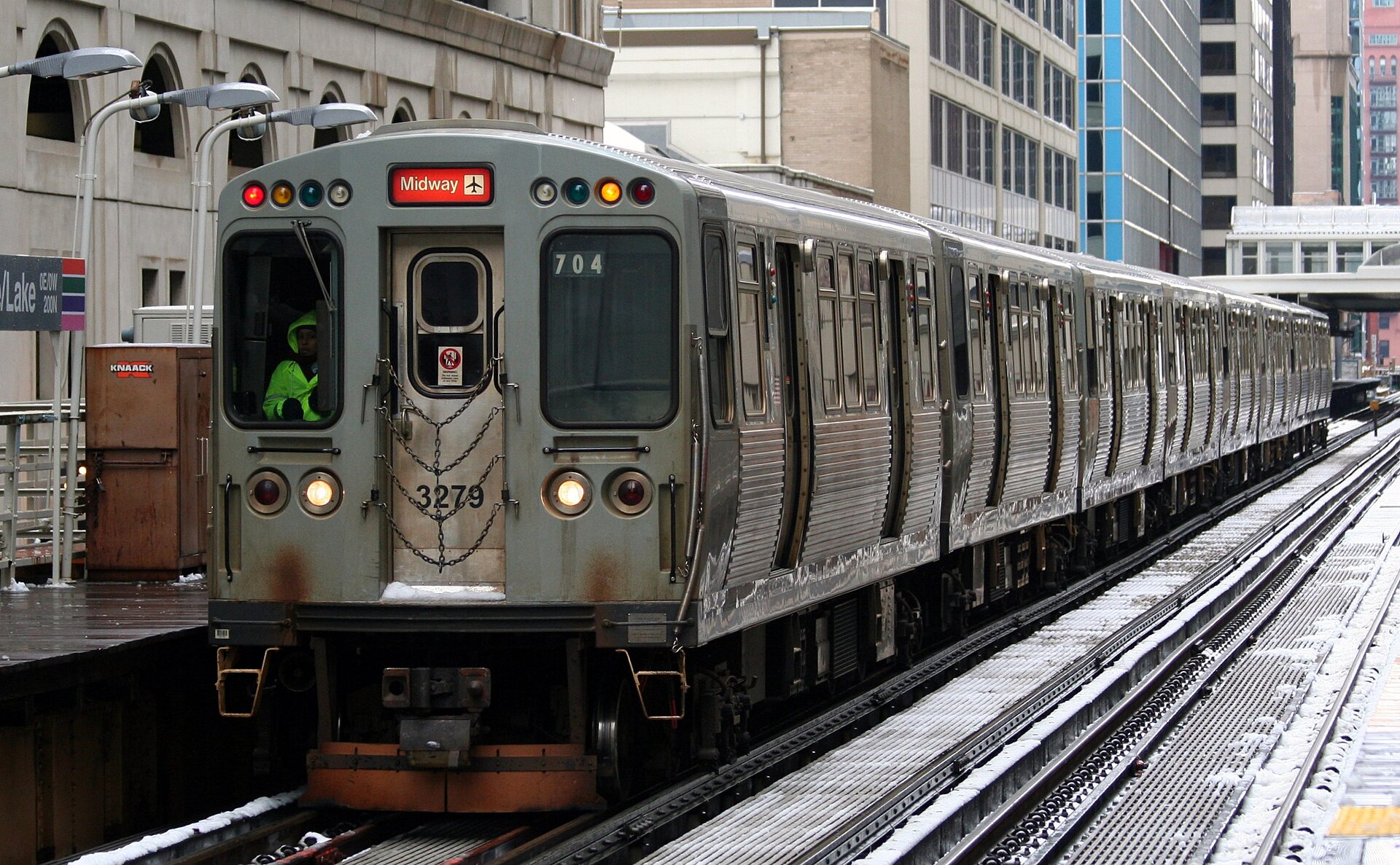 A CTA Orange Line train on the elevated Loop tracks in downtown Chicago