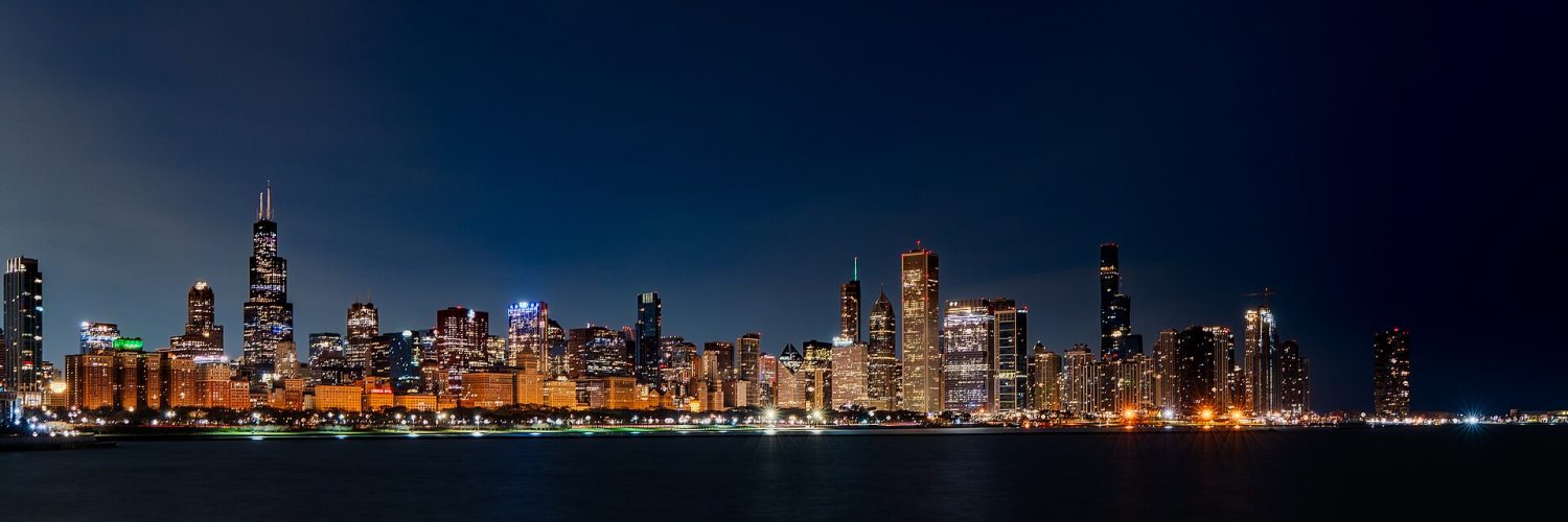 Chicago skyline at sunrise seen across Lake Michigan