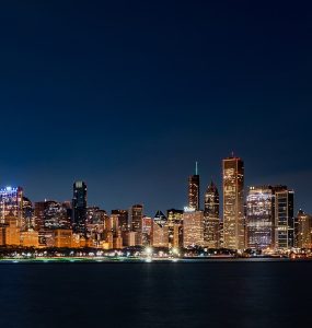 Chicago skyline at sunrise seen across Lake Michigan