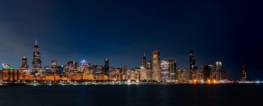 Chicago skyline at sunrise seen across Lake Michigan