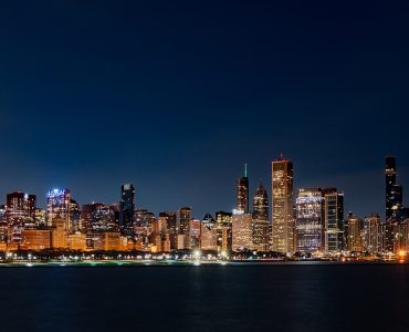 Chicago skyline at sunrise seen across Lake Michigan