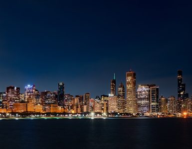 Chicago skyline at sunrise seen across Lake Michigan