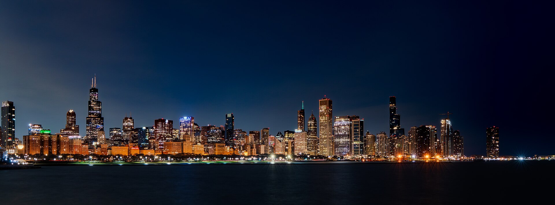 Chicago skyline at sunrise seen across Lake Michigan