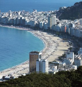 Copacabana beach and its curved avenue backed by apartment blocks in Rio de Janeiro