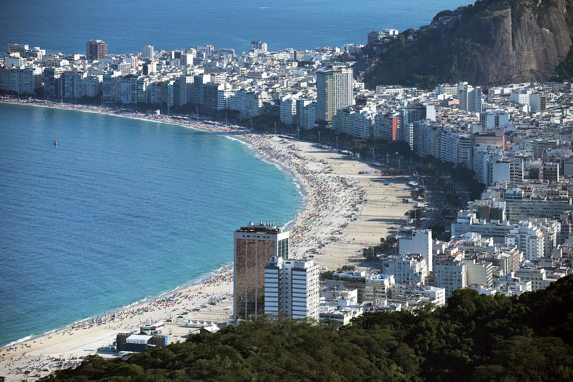 Copacabana beach and its curved avenue backed by apartment blocks in Rio de Janeiro