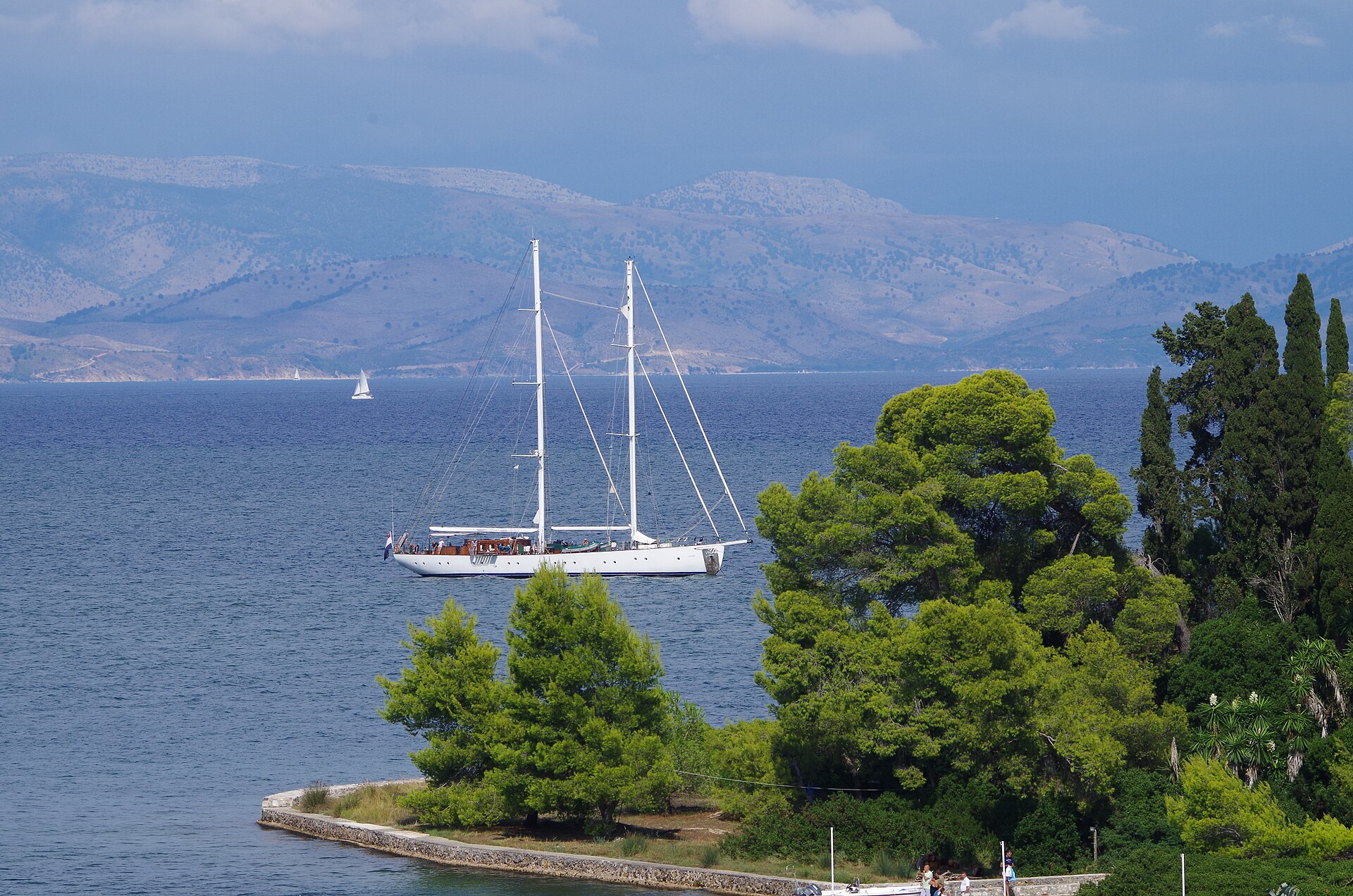 A narrow coastal road running above the sea on Corfu