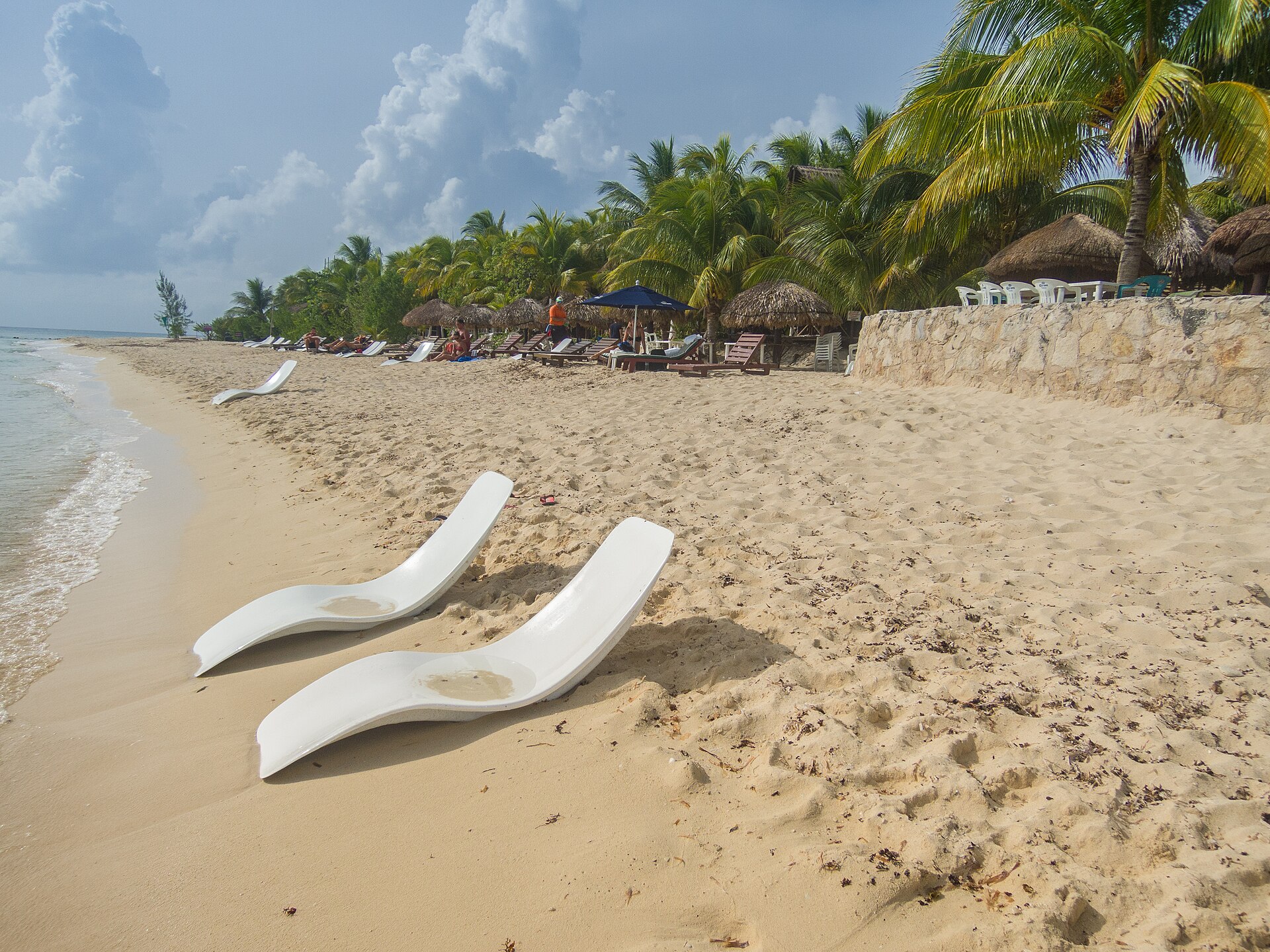 Beach chairs on a calm western beach in Cozumel, Mexico