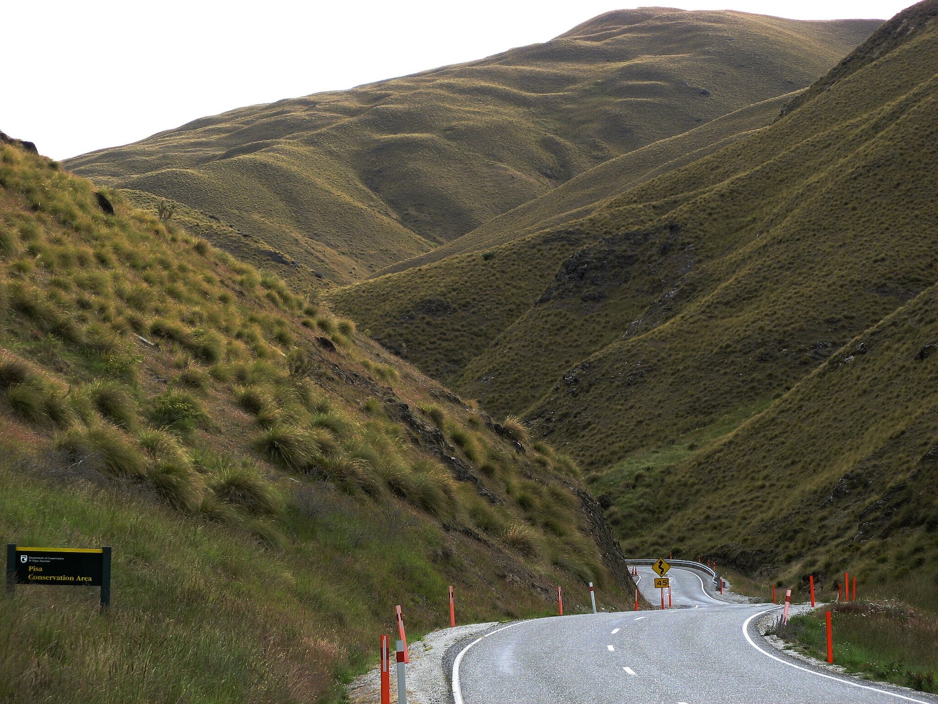 The Crown Range Road climbing in switchbacks above the Wakatipu basin, New Zealand