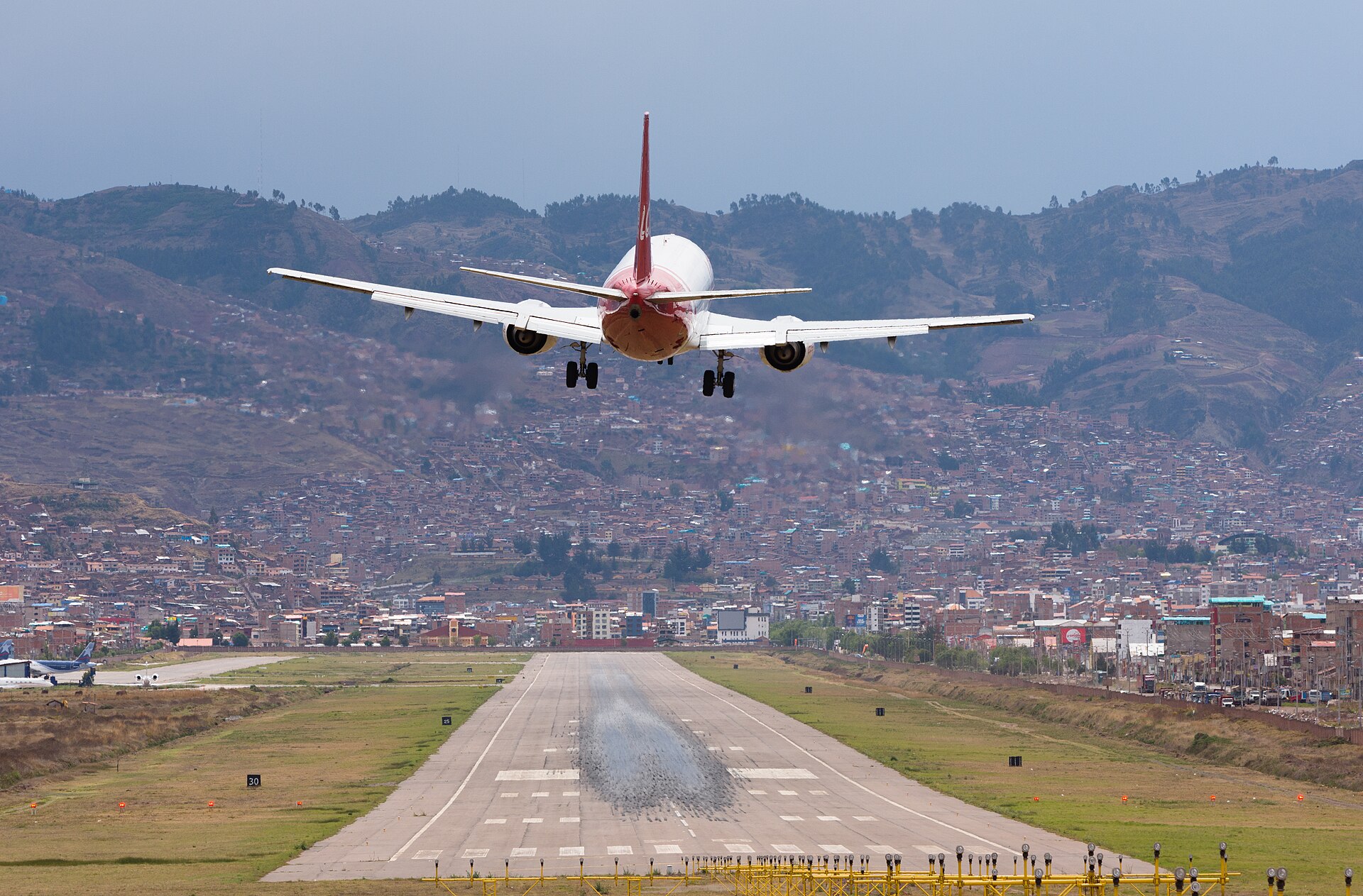 Alejandro Velasco Astete International Airport in Cusco, ringed by Andean hills