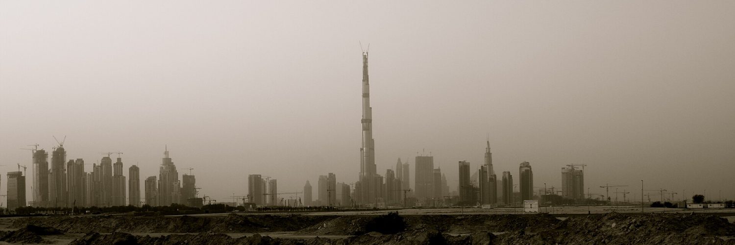 The Burj Khalifa rising above the Downtown Dubai skyline at dusk