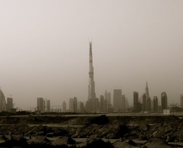 The Burj Khalifa rising above the Downtown Dubai skyline at dusk