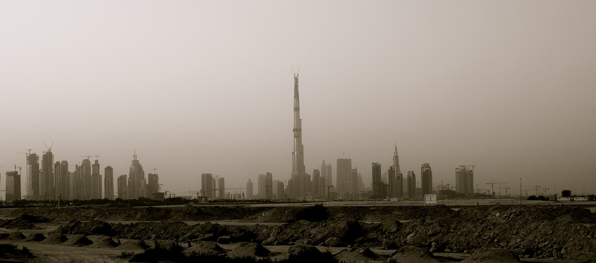 The Burj Khalifa rising above the Downtown Dubai skyline at dusk