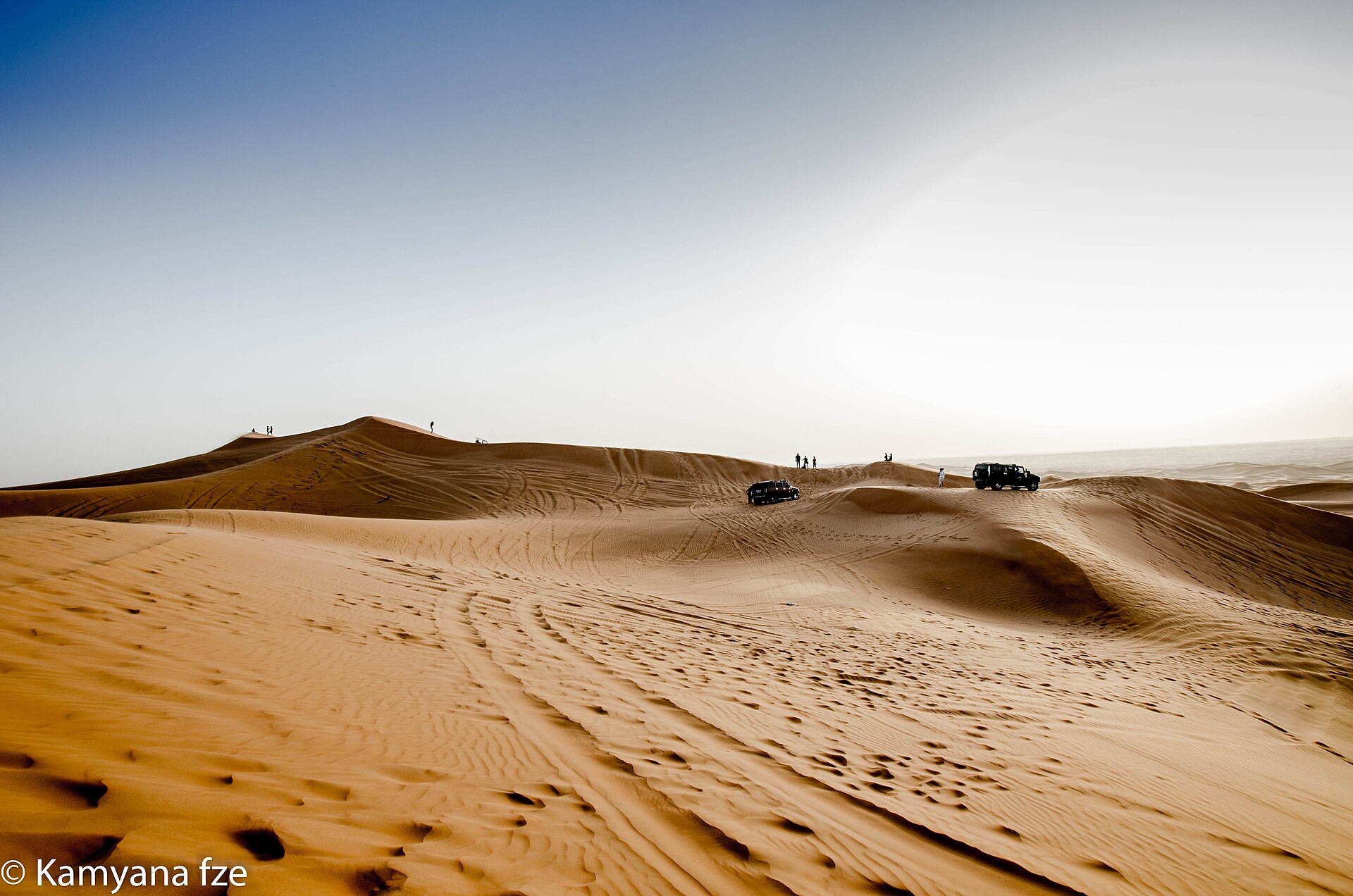 Rolling sand dunes in the desert outside Dubai at golden hour