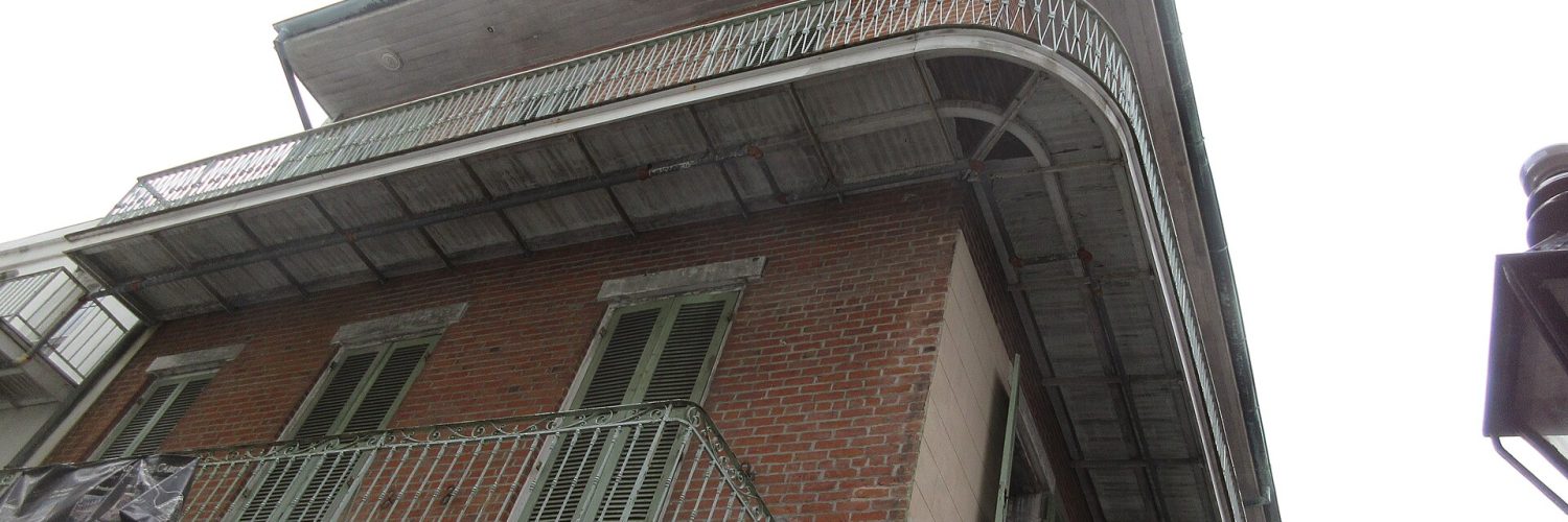 Historic street with iron balconies in the French Quarter, New Orleans