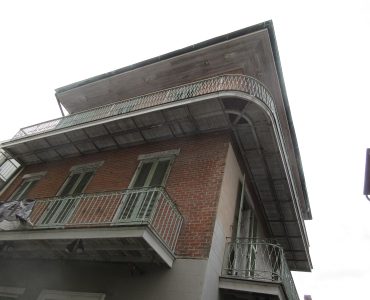 Historic street with iron balconies in the French Quarter, New Orleans