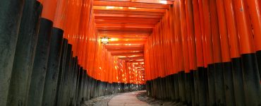 Rows of vermilion torii gates on the hillside path at Fushimi Inari shrine in southern Kyoto