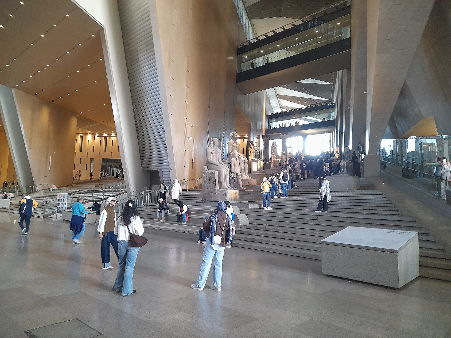 The Grand Egyptian Museum exterior with its translucent alabaster facade near the Giza plateau