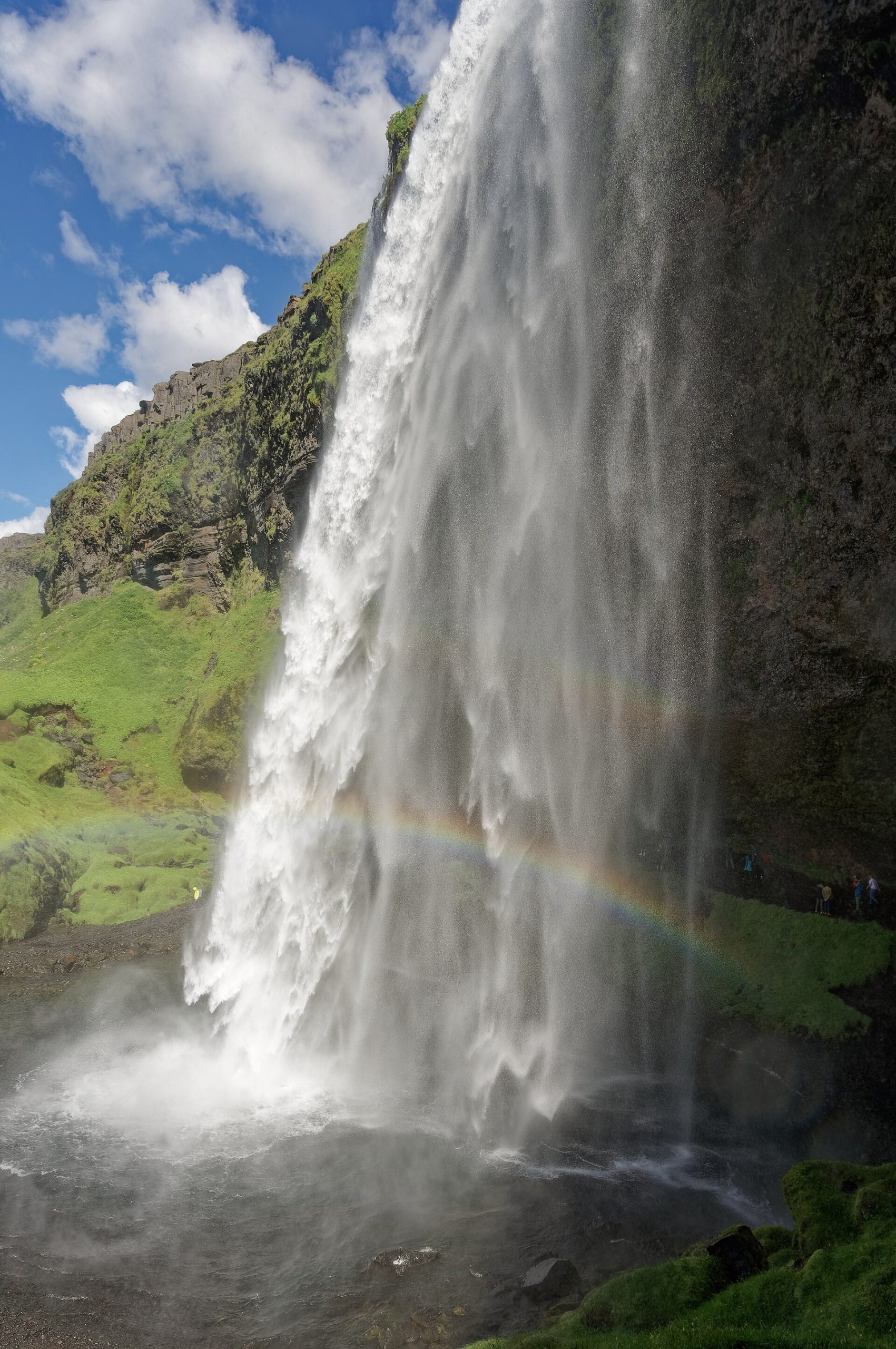 Seljalandsfoss waterfall dropping over a cliff beside the Iceland ring road