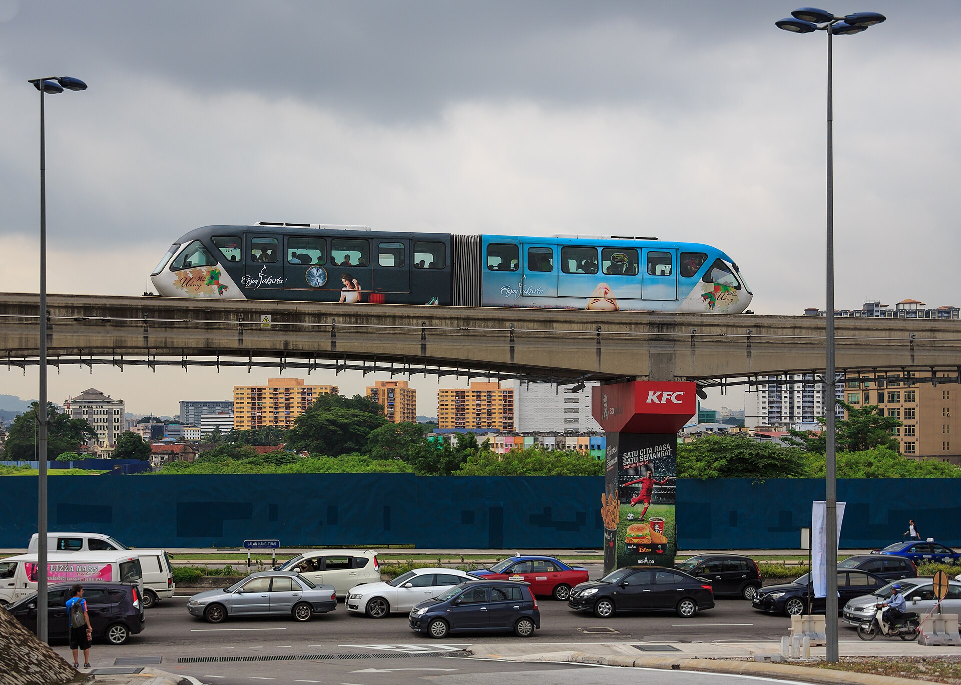 A KL Monorail train on its elevated single track above the streets of Kuala Lumpur