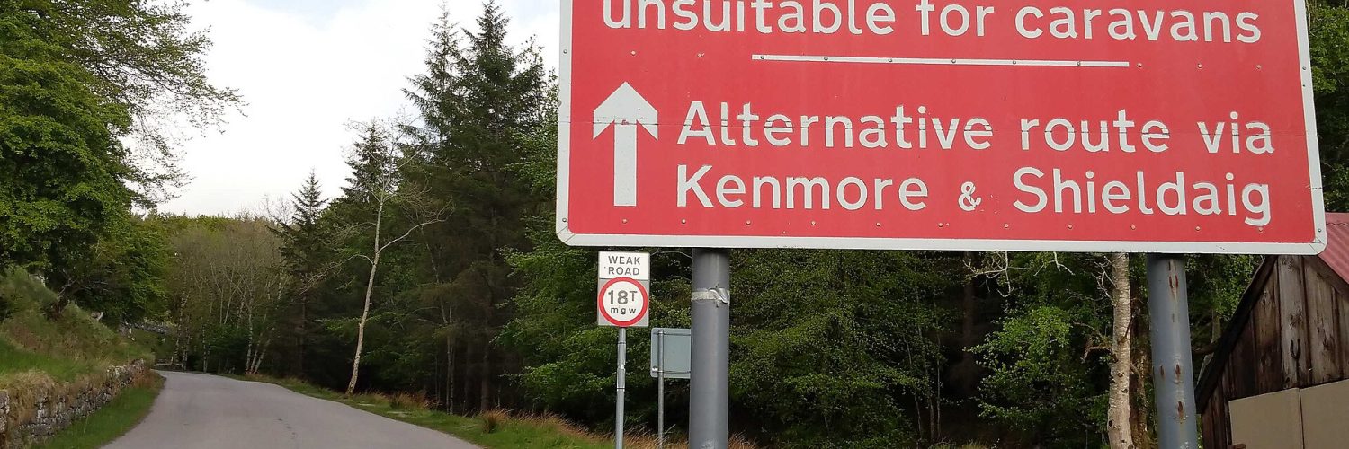 Road on the North Coast 500 route in the Scottish Highlands