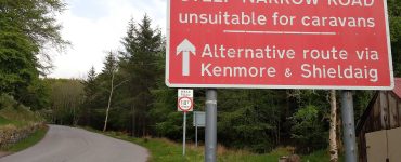 Road on the North Coast 500 route in the Scottish Highlands
