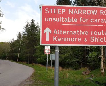 Road on the North Coast 500 route in the Scottish Highlands