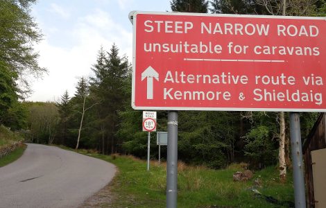 Road on the North Coast 500 route in the Scottish Highlands