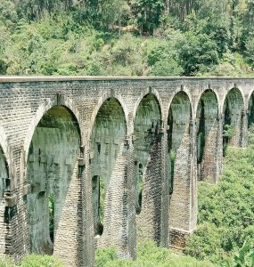 The stone Nine Arch Bridge curving through jungle at Ella, Sri Lanka