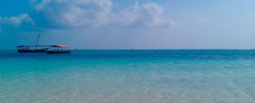 White sand and dhow boats at Nungwi beach in northern Zanzibar