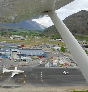 Aerial view of Queenstown Airport runway at Frankton beside Lake Wakatipu