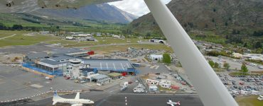 Aerial view of Queenstown Airport runway at Frankton beside Lake Wakatipu