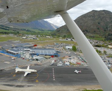 Aerial view of Queenstown Airport runway at Frankton beside Lake Wakatipu