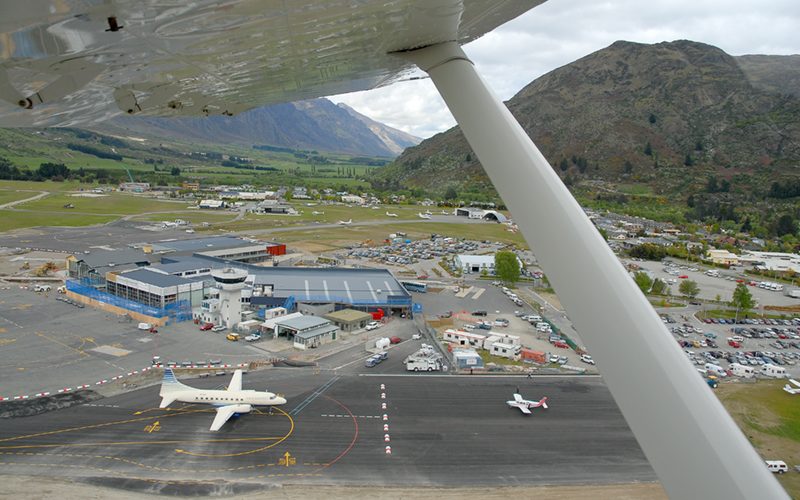 Aerial view of Queenstown Airport runway at Frankton beside Lake Wakatipu