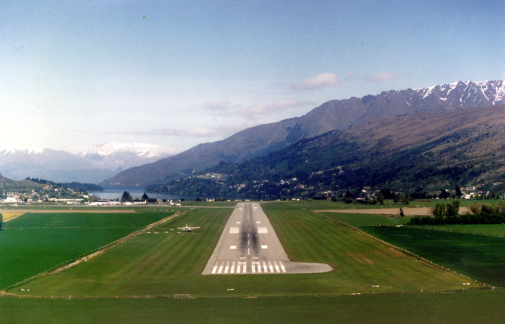 View from an aircraft on final approach into Queenstown between the surrounding mountains