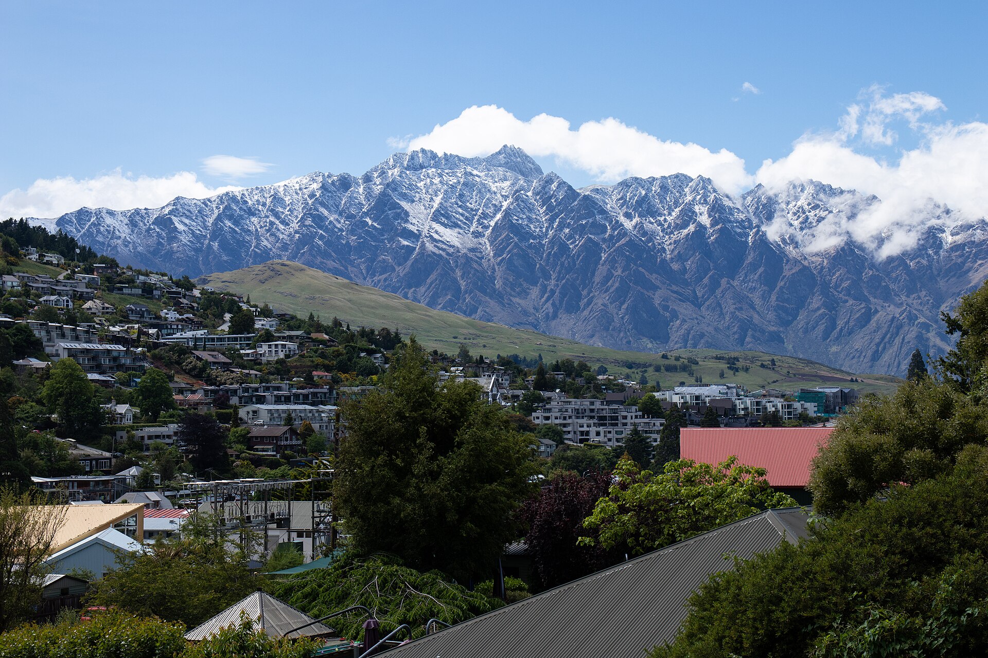 The Remarkables mountain range rising behind Queenstown and Lake Wakatipu