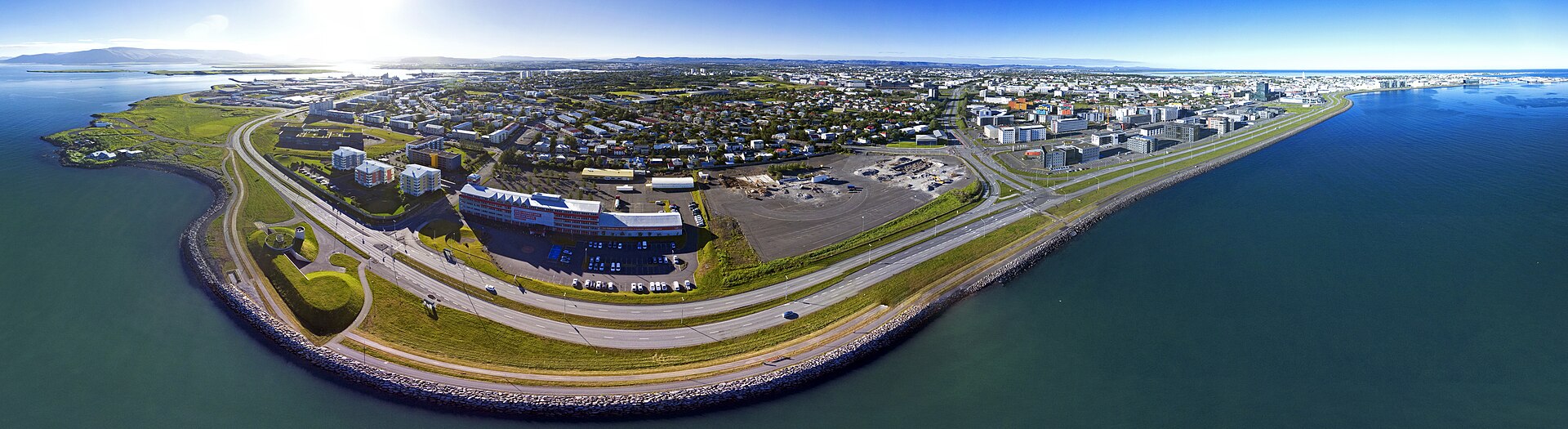 Aerial view over the rooftops of Reykjavik towards Mount Esja