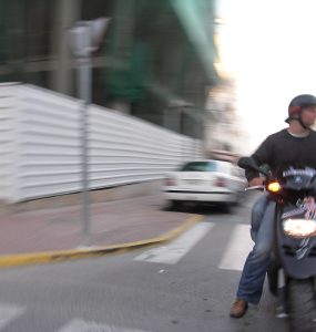 A motor scooter parked on a street in Ibiza, Spain