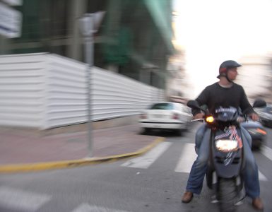 A motor scooter parked on a street in Ibiza, Spain
