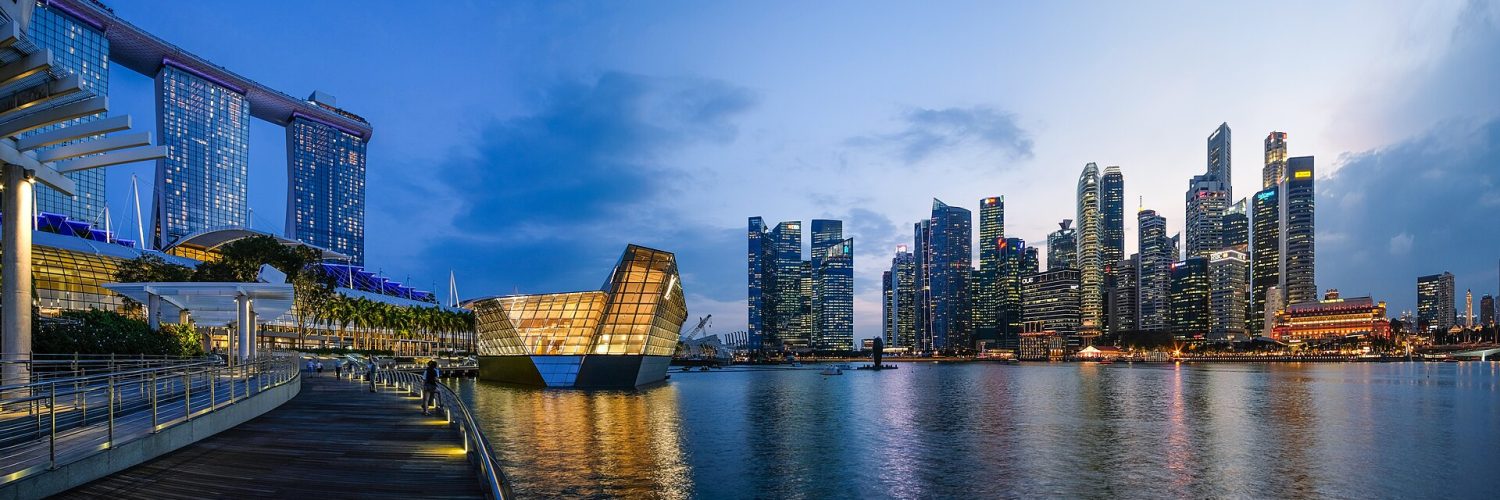 The Marina Bay skyline in Singapore at dusk with Marina Bay Sands on the right