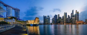 The Marina Bay skyline in Singapore at dusk with Marina Bay Sands on the right