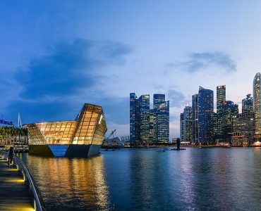 The Marina Bay skyline in Singapore at dusk with Marina Bay Sands on the right